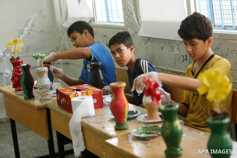 Palestinian children enjoy as part of the activities proposed during a Summer Fun Weeks 2017 organised by the United Nations, in Jabalia refugee camp in the northern Gaza strip, on July 23, 2017. Photo by Ashraf Amra