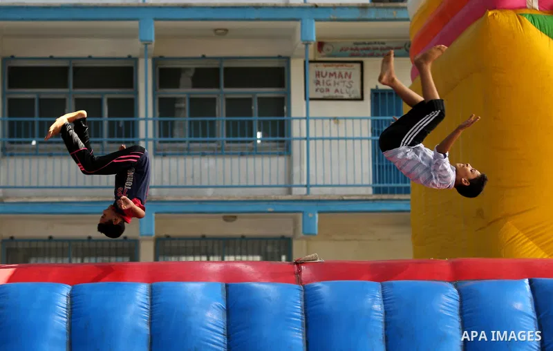 Palestinian children enjoy as part of the activities proposed during a Summer Fun Weeks 2017 organised by the United Nations, in Jabalia refugee camp in the northern Gaza strip, on July 23, 2017. Photo by Ashraf Amra