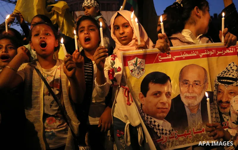 Palestinian children hold candles during a protest against Israel's newly-installed security measures at the entrance to the al-Aqsa mosque compound, in Khan Younis in the southern Gaza Strip July 23, 2017. Photo by Ashr...