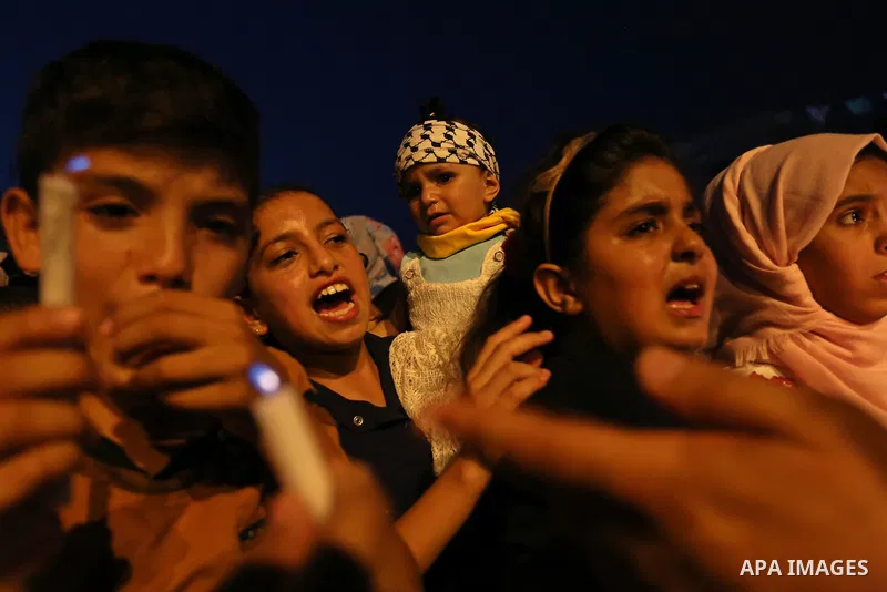 Palestinian children hold candles during a protest against Israel's newly-installed security measures at the entrance to the al-Aqsa mosque compound, in Khan Younis in the southern Gaza Strip July 23, 2017. Photo by Ashr...