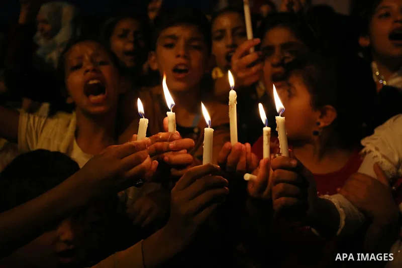Palestinian children hold candles during a protest against Israel's newly-installed security measures at the entrance to the al-Aqsa mosque compound, in Khan Younis in the southern Gaza Strip July 23, 2017. Photo by Ashr...