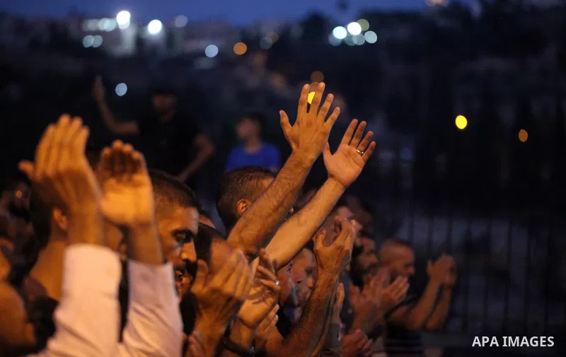 Palestinian Muslim worshippers pray outside Lions' Gate, a main entrance to the Al-Aqsa mosque compound in Jerusalem's Old City, on July 24, 2017, in protest against new Israeli security measures implemented at the holy...