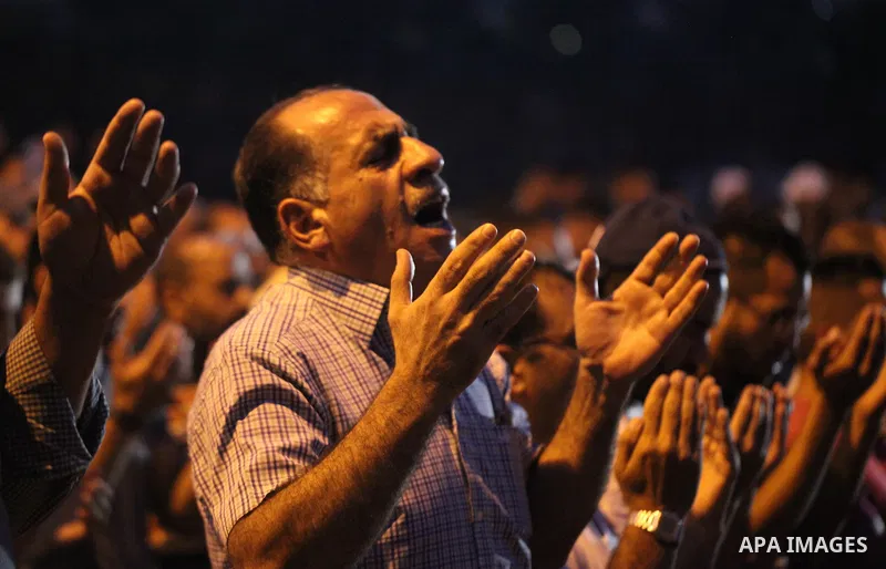 Palestinian Muslim worshippers pray outside Lions' Gate, a main entrance to the Al-Aqsa mosque compound in Jerusalem's Old City, on July 24, 2017, in protest against new Israeli security measures implemented at the holy...