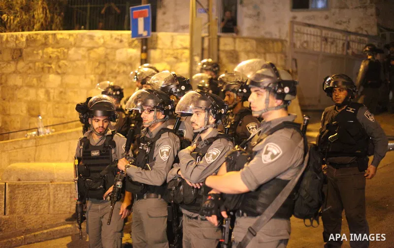 Israeli security forces take position during clashes with Palestinian outside Lions' Gate, a main entrance to the Al-Aqsa mosque compound in Jerusalem's Old City, on July 24, 2017, in protest against new Israeli security...
