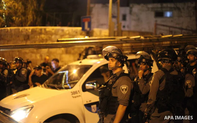 Israeli security forces take position during clashes with Palestinian outside Lions' Gate, a main entrance to the Al-Aqsa mosque compound in Jerusalem's Old City, on July 24, 2017, in protest against new Israeli security...