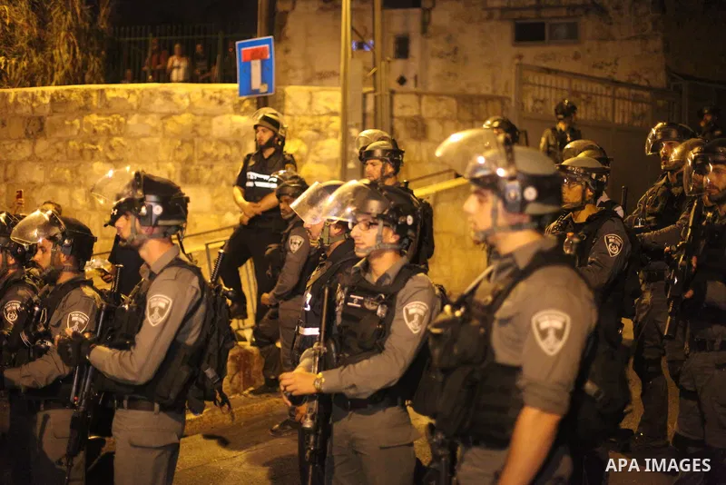 Israeli security forces take position during clashes with Palestinian outside Lions' Gate, a main entrance to the Al-Aqsa mosque compound in Jerusalem's Old City, on July 24, 2017, in protest against new Israeli security...