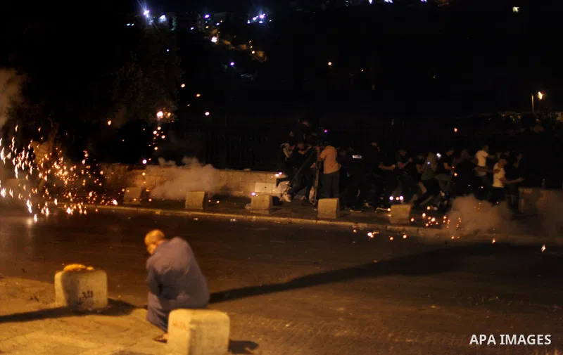 Israeli security forces clash with Palestinians outside Lions' Gate, a main entrance to the Al-Aqsa mosque compound in Jerusalem's Old City, on July 24, 2017, in protest against new Israeli security measures implemented...