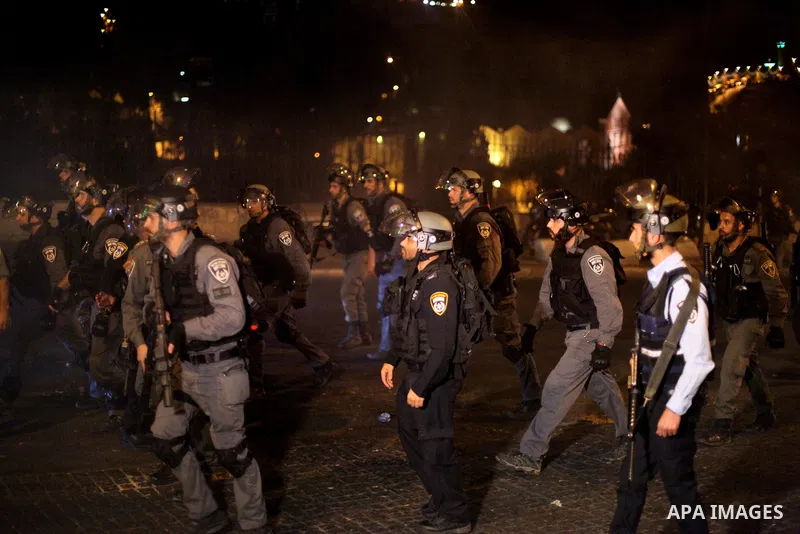 Israeli security forces take position during clashes with Palestinian outside Lions' Gate, a main entrance to the Al-Aqsa mosque compound in Jerusalem's Old City, on July 24, 2017, in protest against new Israeli security...