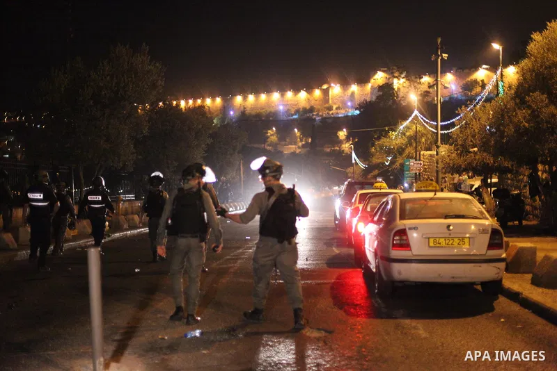 Israeli security forces take position during clashes with Palestinian outside Lions' Gate, a main entrance to the Al-Aqsa mosque compound in Jerusalem's Old City, on July 24, 2017, in protest against new Israeli security...