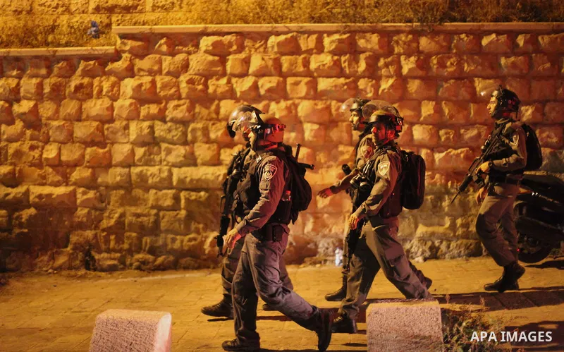 Israeli security forces take position during clashes with Palestinian outside Lions' Gate, a main entrance to the Al-Aqsa mosque compound in Jerusalem's Old City, on July 24, 2017, in protest against new Israeli security...