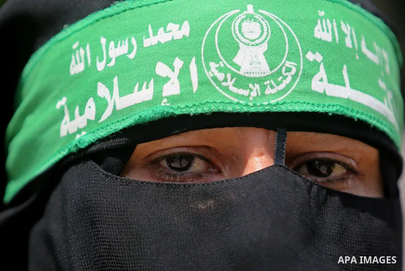 A masked female protester takes part during a demonstration against Israeli security measures that were implemented at the Al-Aqsa mosque compound in Jerusalem the previous week prior to being removed after their install...