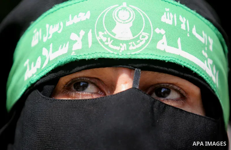 A masked female protester takes part during a demonstration against Israeli security measures that were implemented at the Al-Aqsa mosque compound in Jerusalem the previous week prior to being removed after their install...