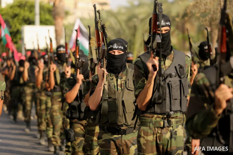 Palestinian militants from different local factions take part in a military parade against Israel in Gaza City on July 25, 2017. Photo by Ashraf Amra