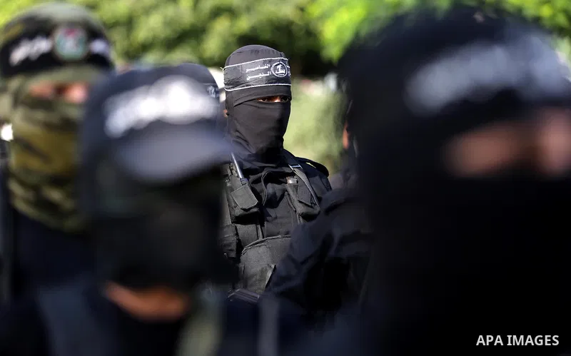 Palestinian militants from different local factions take part in a military parade against Israel in Gaza City on July 25, 2017. Photo by Ashraf Amra