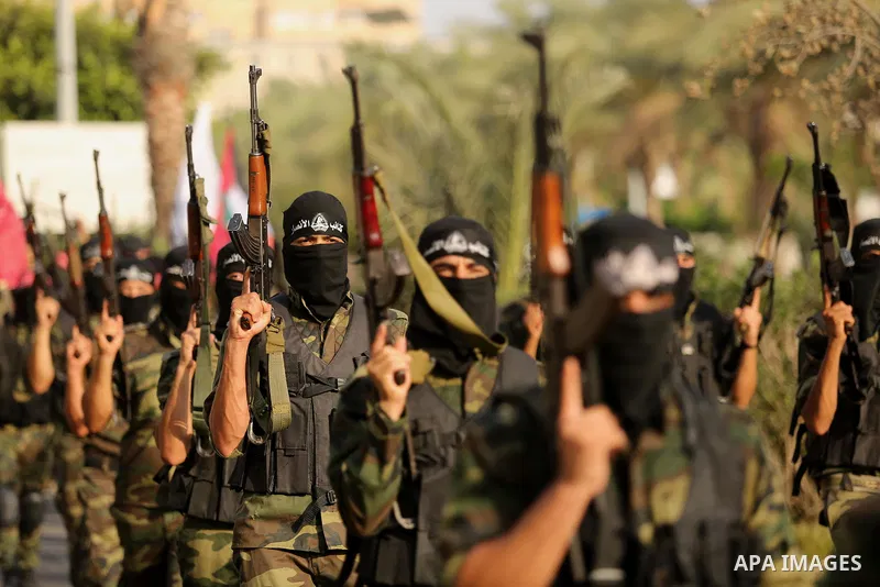 Palestinian militants from different local factions take part in a military parade against Israel in Gaza City on July 25, 2017. Photo by Ashraf Amra