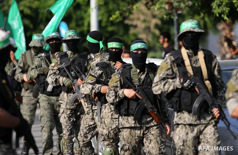 Palestinian militants from different local factions take part in a military parade against Israel in Gaza City on July 25, 2017. Photo by Ashraf Amra