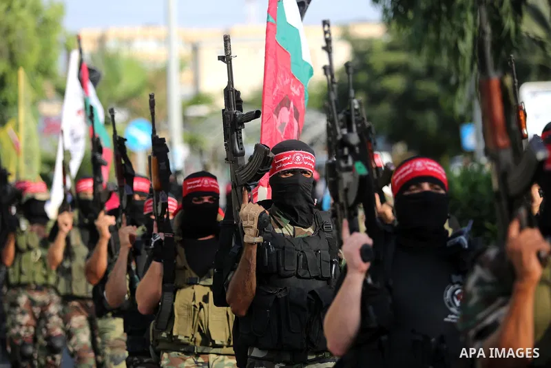 Palestinian militants from different local factions take part in a military parade against Israel in Gaza City on July 25, 2017. Photo by Ashraf Amra
