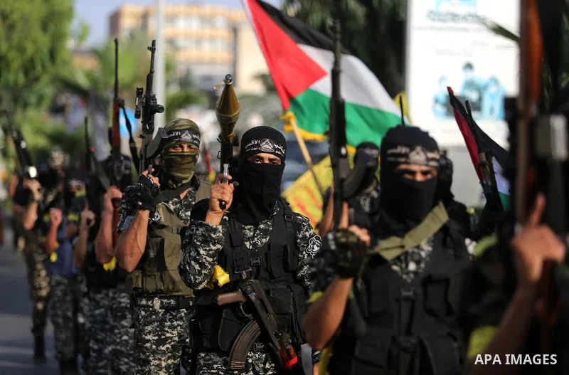 Palestinian militants from different local factions take part in a military parade against Israel in Gaza City on July 25, 2017. Photo by Ashraf Amra