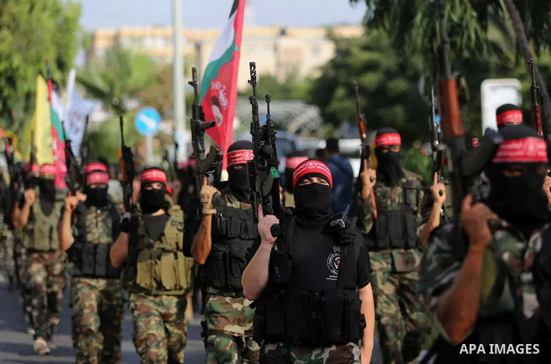Palestinian militants from different local factions take part in a military parade against Israel in Gaza City on July 25, 2017. Photo by Ashraf Amra