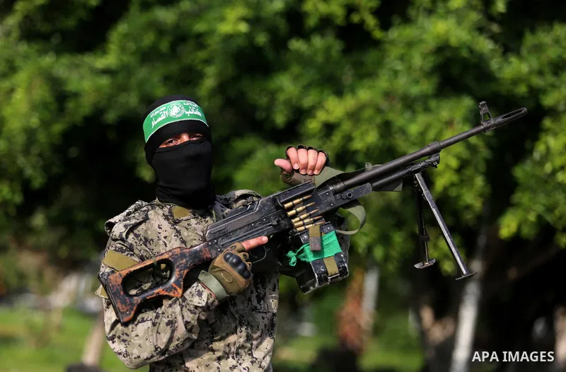 Palestinian militants from different local factions take part in a military parade against Israel in Gaza City on July 25, 2017. Photo by Ashraf Amra