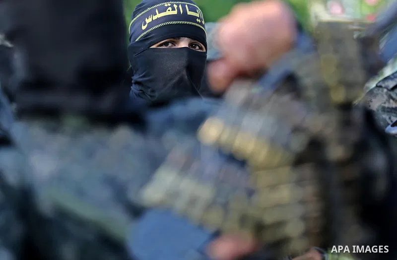Palestinian militants from different local factions take part in a military parade against Israel in Gaza City on July 25, 2017. Photo by Ashraf Amra