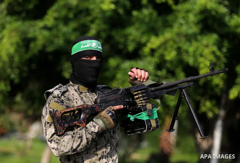 Palestinian militants from different local factions take part in a military parade against Israel in Gaza City on July 25, 2017. Photo by Ashraf Amra