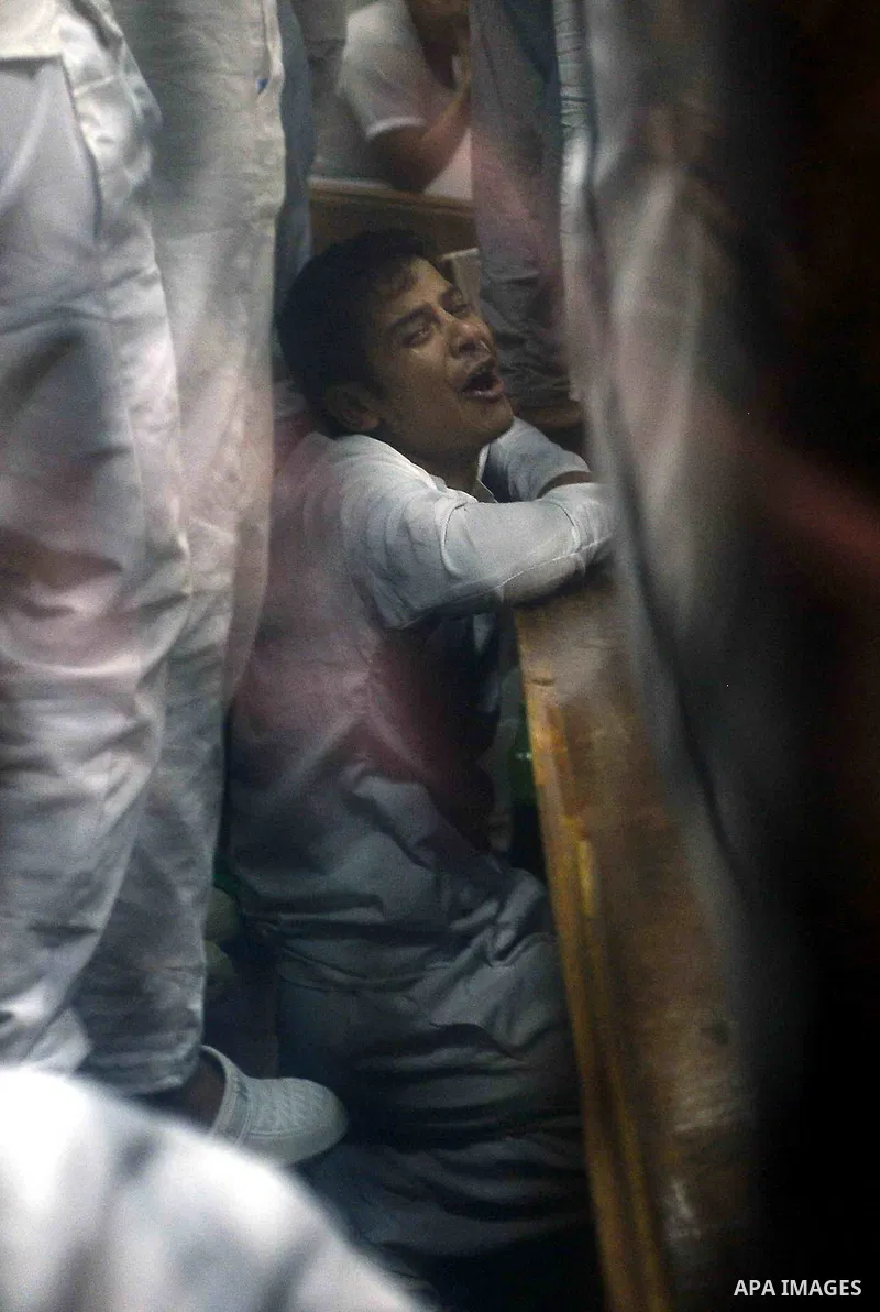 Egyptian defendants sits behind the defendant's bars during their trial at "Cabinet Incidents" case at the court in Cairo, Egypt, on July 25, 2017. An Egyptian criminal court sentenced 43 activists to life in prison on T...