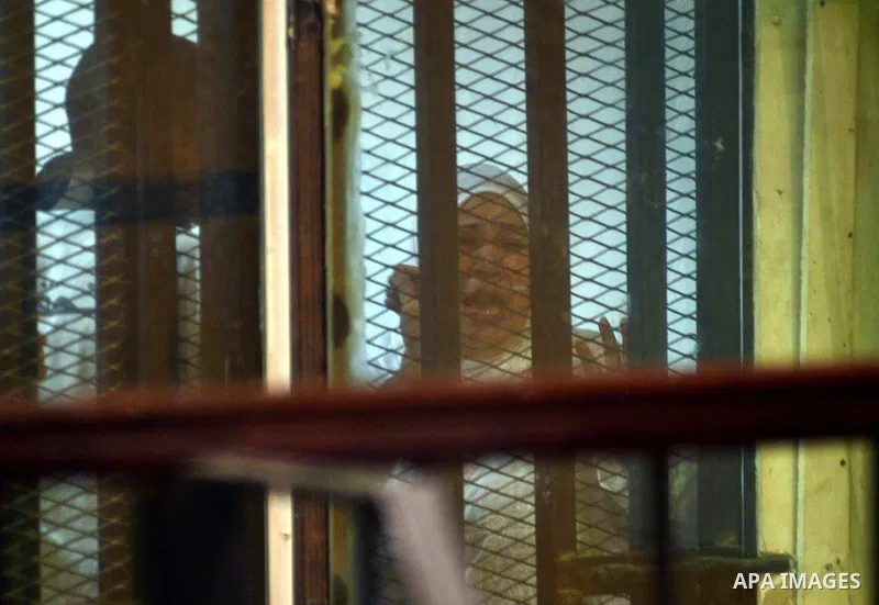 Egyptian defendants sits behind the defendant's bars during their trial at "Cabinet Incidents" case at the court in Cairo, Egypt, on July 25, 2017. An Egyptian criminal court sentenced 43 activists to life in prison on T...