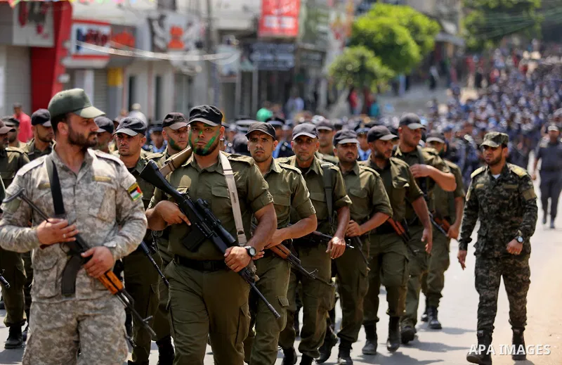 Members of Palestinian forces in Gaza strip take part in a military parade in Gaza City on July 26, 2017 as a tense standoff is underway between Israel and Muslim worshippers at Jerusalem's Al-Aqsa compound. Muslims have...