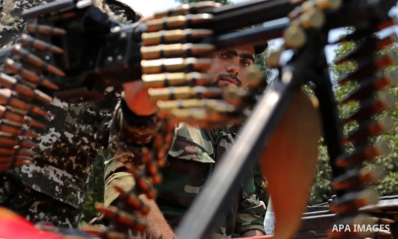 Members of Palestinian forces in Gaza strip take part in a military parade in Gaza City on July 26, 2017 as a tense standoff is underway between Israel and Muslim worshippers at Jerusalem's Al-Aqsa compound. Muslims have...