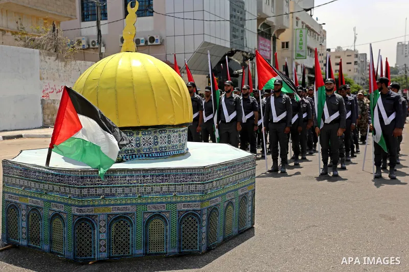Members of Palestinian forces in Gaza strip take part in a military parade in Gaza City on July 26, 2017 as a tense standoff is underway between Israel and Muslim worshippers at Jerusalem's Al-Aqsa compound. Muslims have...