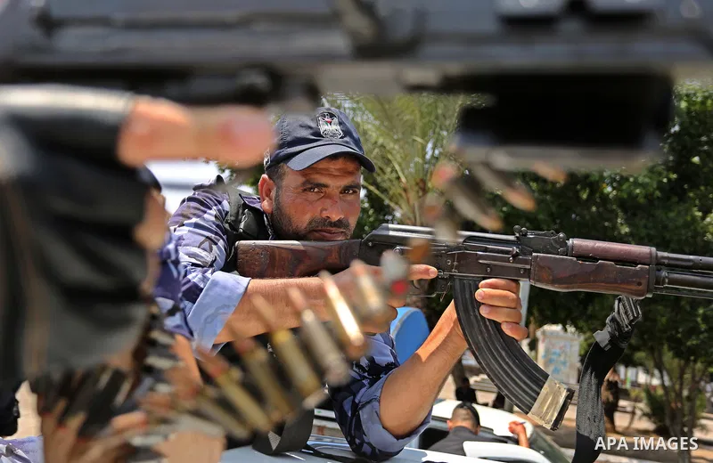Members of Palestinian forces in Gaza strip take part in a military parade in Gaza City on July 26, 2017 as a tense standoff is underway between Israel and Muslim worshippers at Jerusalem's Al-Aqsa compound. Muslims have...