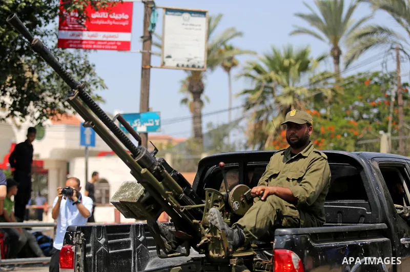 Members of Palestinian forces in Gaza strip take part in a military parade in Gaza City on July 26, 2017 as a tense standoff is underway between Israel and Muslim worshippers at Jerusalem's Al-Aqsa compound. Muslims have...