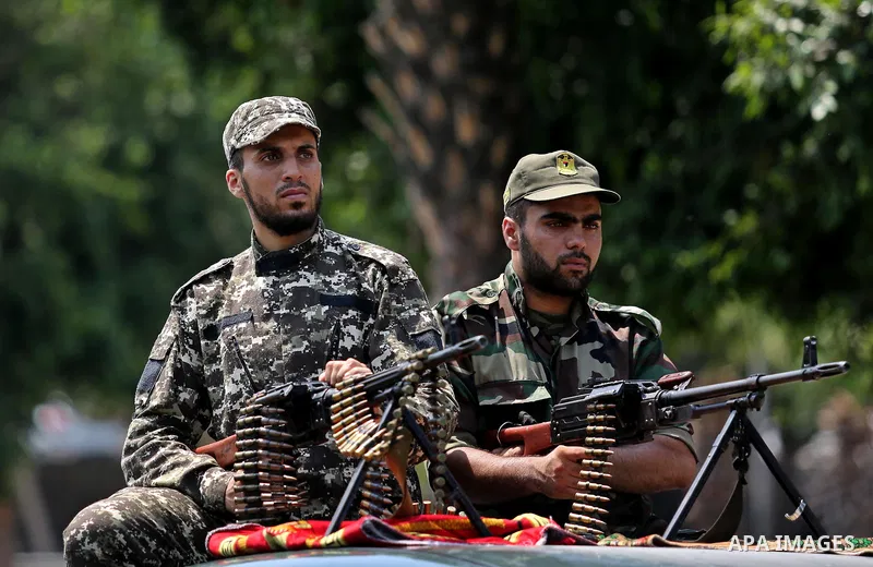 Members of Palestinian forces in Gaza strip take part in a military parade in Gaza City on July 26, 2017 as a tense standoff is underway between Israel and Muslim worshippers at Jerusalem's Al-Aqsa compound. Muslims have...