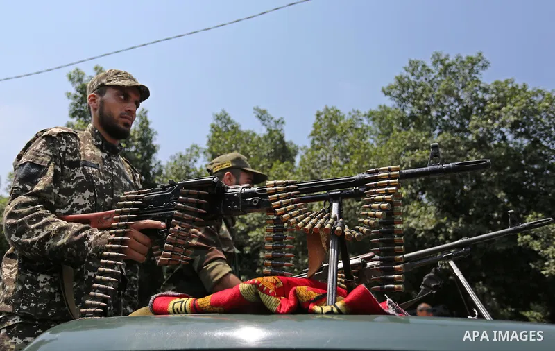 Members of Palestinian forces in Gaza strip take part in a military parade in Gaza City on July 26, 2017 as a tense standoff is underway between Israel and Muslim worshippers at Jerusalem's Al-Aqsa compound. Muslims have...