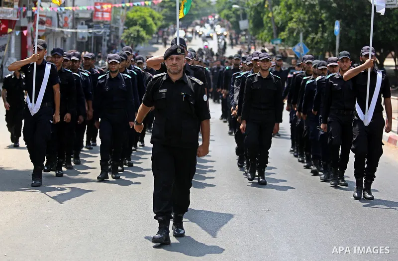 Members of Palestinian forces in Gaza strip take part in a military parade in Gaza City on July 26, 2017 as a tense standoff is underway between Israel and Muslim worshippers at Jerusalem's Al-Aqsa compound. Muslims have...