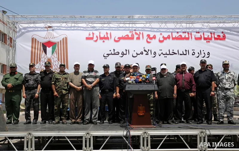 Deputy of the Legislative Council, Ahmed Bahar speaks as Members of Palestinian forces take part in military parade in Gaza City on July 26, 2017 as a tense standoff is underway between Israel and Muslim worshippers at J...