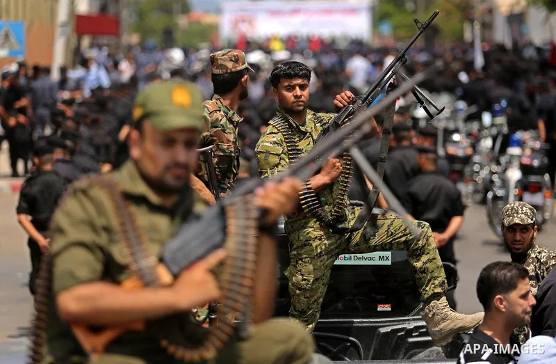 Members of Palestinian forces in Gaza strip take part in a military parade in Gaza City on July 26, 2017 as a tense standoff is underway between Israel and Muslim worshippers at Jerusalem's Al-Aqsa compound. Muslims have...