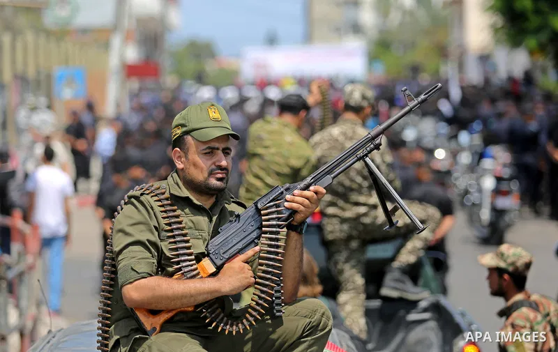Members of Palestinian forces in Gaza strip take part in a military parade in Gaza City on July 26, 2017 as a tense standoff is underway between Israel and Muslim worshippers at Jerusalem's Al-Aqsa compound. Muslims have...