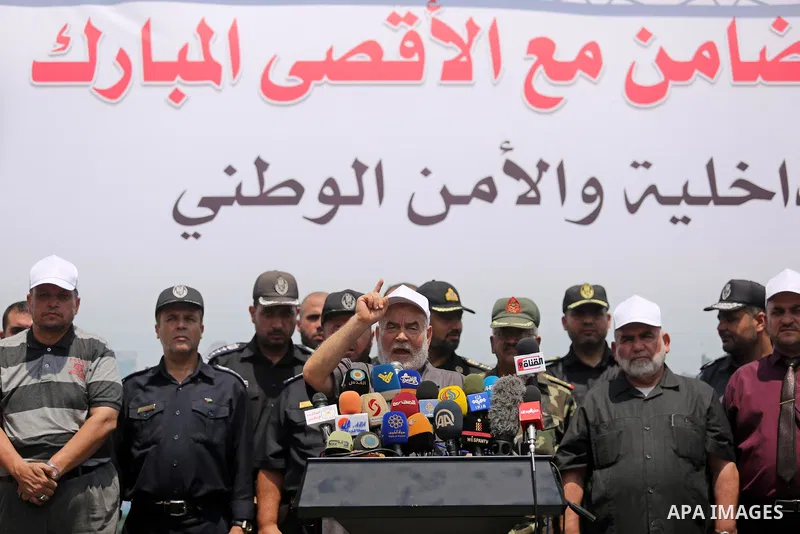Deputy of the Legislative Council, Ahmed Bahar speaks as Members of Palestinian forces take part in military parade in Gaza City on July 26, 2017 as a tense standoff is underway between Israel and Muslim worshippers at J...