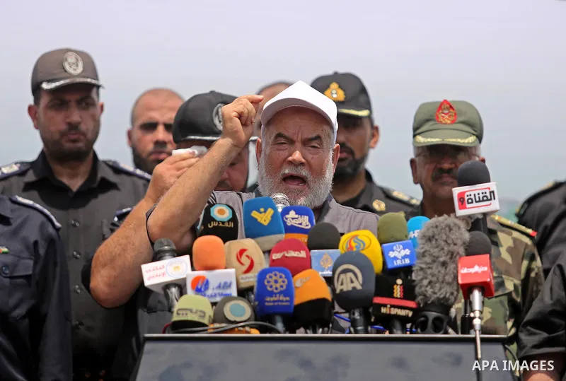 Deputy of the Legislative Council, Ahmed Bahar speaks as Members of Palestinian forces take part in military parade in Gaza City on July 26, 2017 as a tense standoff is underway between Israel and Muslim worshippers at J...