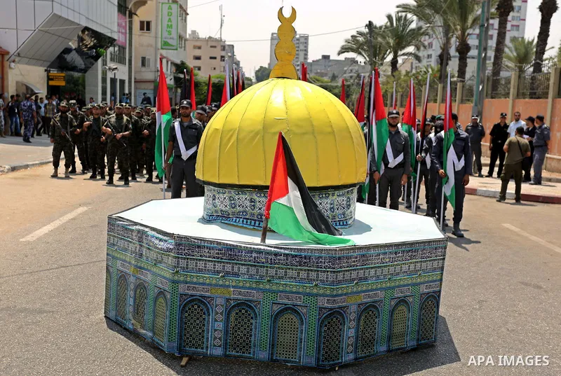 Members of Palestinian forces in Gaza strip take part in a military parade in Gaza City on July 26, 2017 as a tense standoff is underway between Israel and Muslim worshippers at Jerusalem's Al-Aqsa compound. Muslims have...