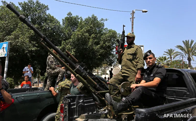 Members of Palestinian forces in Gaza strip take part in a military parade in Gaza City on July 26, 2017 as a tense standoff is underway between Israel and Muslim worshippers at Jerusalem's Al-Aqsa compound. Muslims have...