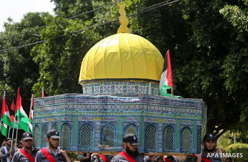 Members of Palestinian forces in Gaza strip carry a model of the Dome of the Rock in a military parade in Gaza City on July 26, 2017 as a tense standoff is underway between Israel and Muslim worshippers at Jerusalem's Al...