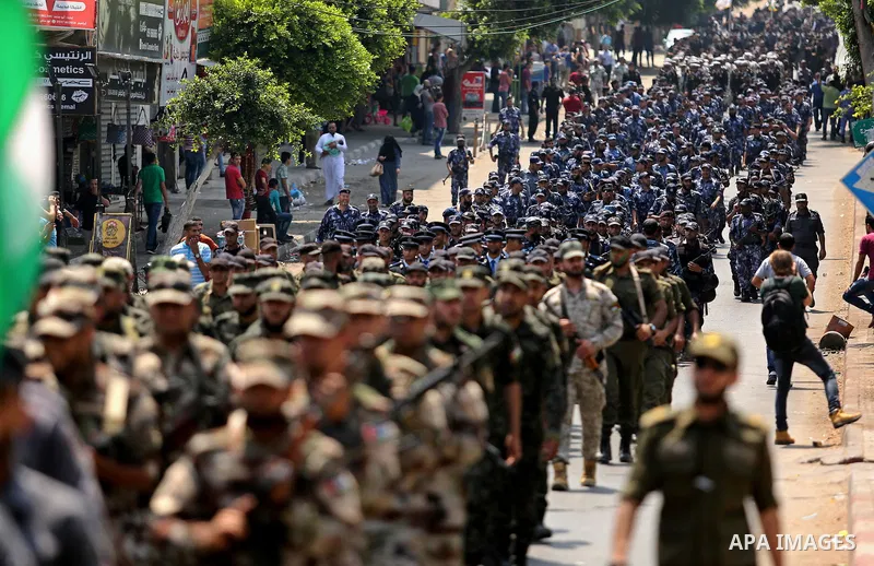 Members of Palestinian forces in Gaza strip take part in a military parade in Gaza City on July 26, 2017 as a tense standoff is underway between Israel and Muslim worshippers at Jerusalem's Al-Aqsa compound. Muslims have...