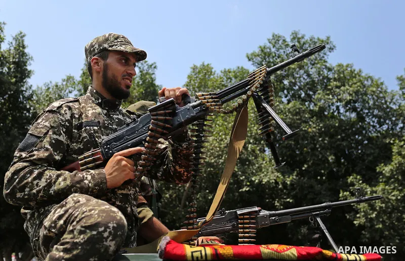 Members of Palestinian forces in Gaza strip take part in a military parade in Gaza City on July 26, 2017 as a tense standoff is underway between Israel and Muslim worshippers at Jerusalem's Al-Aqsa compound. Muslims have...
