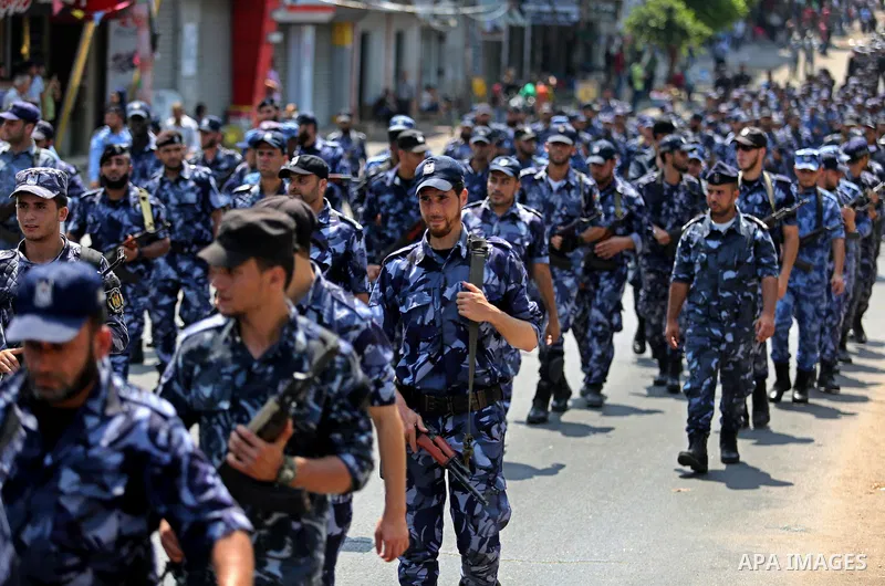 Members of Palestinian forces in Gaza strip take part in a military parade in Gaza City on July 26, 2017 as a tense standoff is underway between Israel and Muslim worshippers at Jerusalem's Al-Aqsa compound. Muslims have...