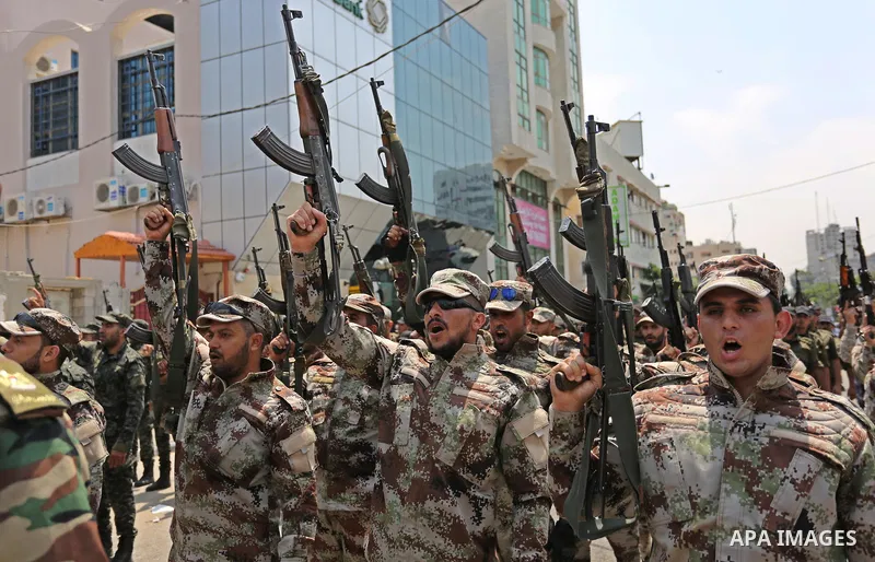 Members of Palestinian forces in Gaza strip take part in a military parade in Gaza City on July 26, 2017 as a tense standoff is underway between Israel and Muslim worshippers at Jerusalem's Al-Aqsa compound. Muslims have...