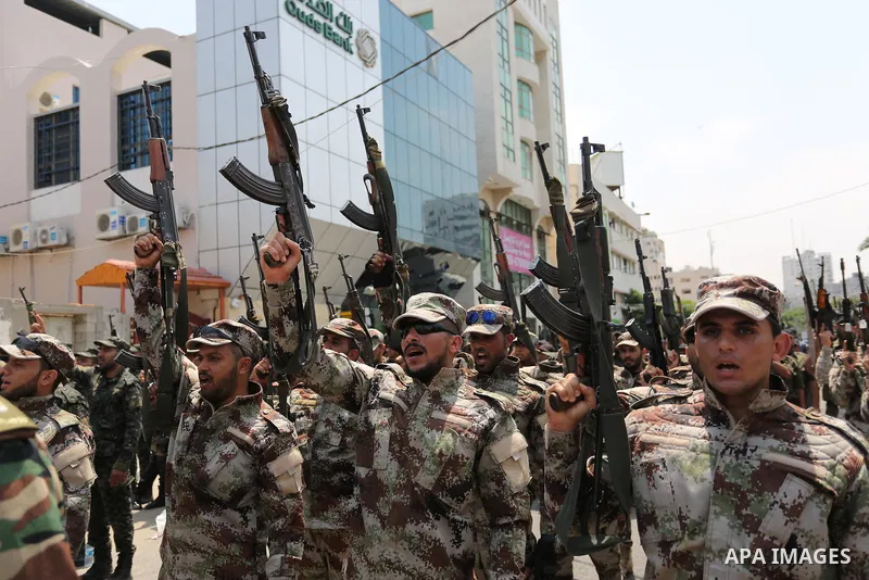 Members of Palestinian forces in Gaza strip take part in a military parade in Gaza City on July 26, 2017 as a tense standoff is underway between Israel and Muslim worshippers at Jerusalem's Al-Aqsa compound. Muslims have...