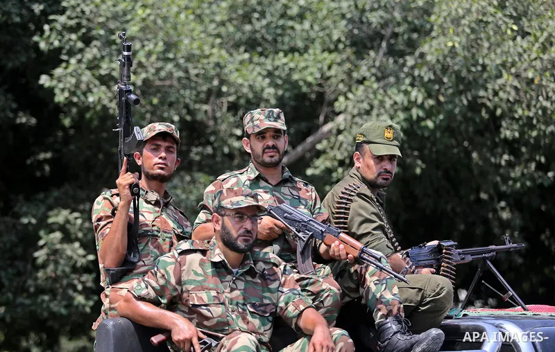 Members of Palestinian forces in Gaza strip take part in a military parade in Gaza City on July 26, 2017 as a tense standoff is underway between Israel and Muslim worshippers at Jerusalem's Al-Aqsa compound. Muslims have...